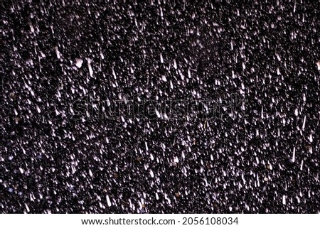 Raindrops on a black background. Rain in the dark. Graphic resource or template for editing. Blank for a retoucher.