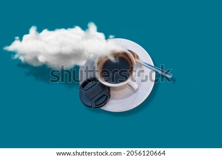 A cup of coffee with a cloud above it and a blue table below it