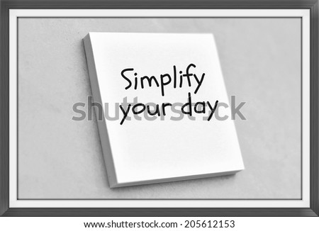 Vintage style text simplify your day on the short note texture background