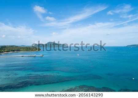 Aerial view drone shot of tropical sea at rawai beach Phuket Thailand Beautiful scenery andaman sea and small island in summer season Beautiful travel background and website design nature view.