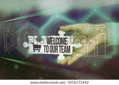 Conceptual caption Welcome To Our Team. Conceptual photo introducing another person to your team mates Hand Holding Jigsaw Puzzle Piece Unlocking New Futuristic Technologies.