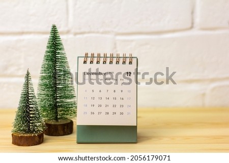December 2021 is on the calendar.Desktop flip calendar .Hello December Royalty-Free Stock Photo #2056179071