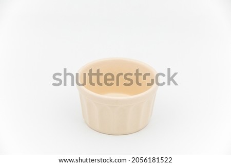 Empty ceramic cream bowl isolated on white background