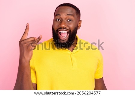 Photo of cool happy crazy afro american man music lover make rock sing isolated on pink color background
