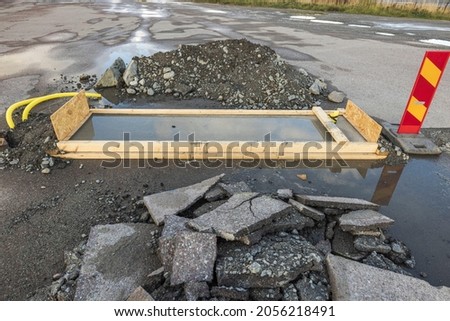 Close up view of part of road under reconstruction. Road renovation work. Sweden. 