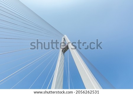 close-up of cable-stayed bridge against a blue sky, Chinese characters on the bridge tower read: Wuxue Bridge, is Hubei - Jiangxi province another fast channel across the Yangtze river Royalty-Free Stock Photo #2056262531