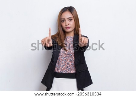 beautiful young business woman with open hand doing stop sign with serious expression defense gesture isolated on white background
