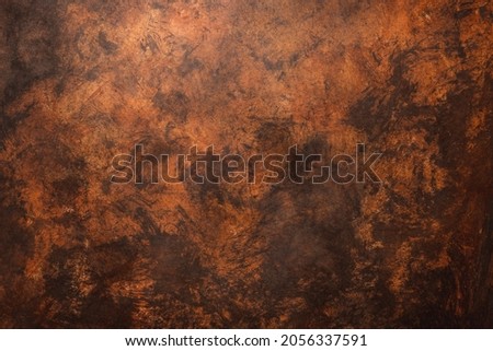 Brown weathered wall textured background with reddish tones. Aged wall. Royalty-Free Stock Photo #2056337591