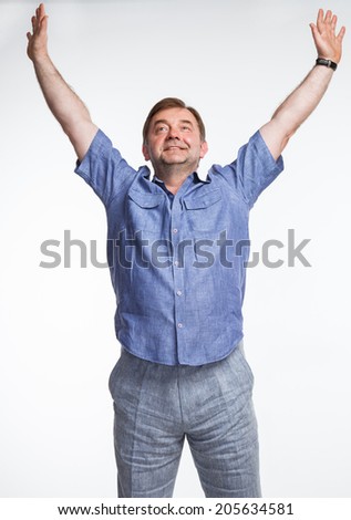 Portrait oa a happy man raising his hands, white background
