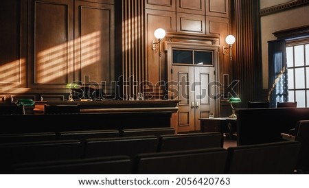 Empty American Style Courtroom. Supreme Court of Law and Justice Trial Stand. Courthouse Before Civil Case Hearing Starts. Grand Wooden Interior with Judge's Bench, Defendant's and Plaintiff's Tables. Royalty-Free Stock Photo #2056420763