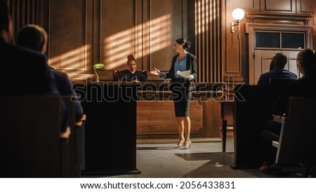 Court of Justice and Law Trial: Successful Female Prosecutor Presenting the Case, Making Passionate Speech to Judge, Jury. Attorney Lawyer Protecting Client with Closing Not Guilty Arguments. Royalty-Free Stock Photo #2056433831