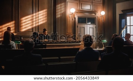 Court of Justice and Law Trial: Public is Sitting on Benches, Listening to Impartial Judge. Supreme Federal Court African American Judge Starts Civil Case Hearing with Striking a Gavel. Royalty-Free Stock Photo #2056433849