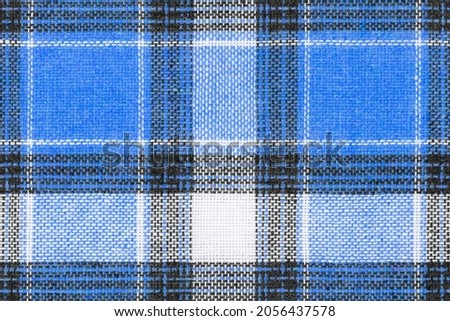 Blue white tartan texture background. shirt fabric with a checkered pattern. factory material Royalty-Free Stock Photo #2056437578