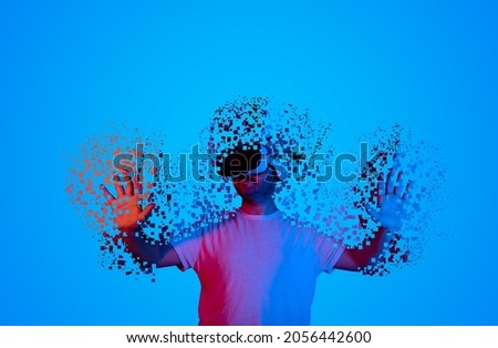 introduction to the metaverse universe. Man wearing augmented reality glasses for future technology. transition to the virtual world. Royalty-Free Stock Photo #2056442600