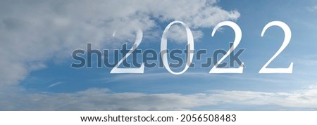 New year 2022 written in the sky. Abstract new years banner. Royalty-Free Stock Photo #2056508483