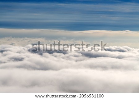 Landscape from the cockpit of an aircraft. Sky with clouds