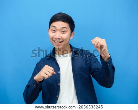 Man gesture funny dance blue background