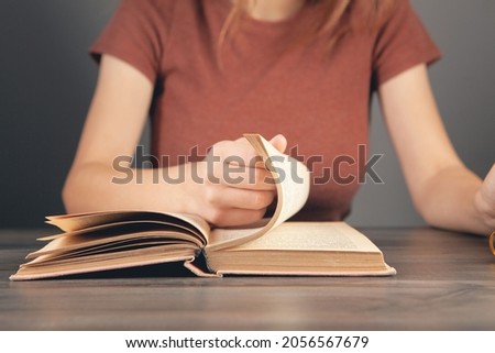 girl reading a book in the library
