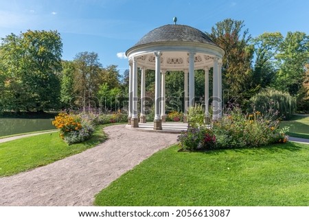 Circular temple, known as Temple of Love (early 19th century) in neoclassical style. Parc de l'Orangerie in Strasbourg. France, Europe. Royalty-Free Stock Photo #2056613087