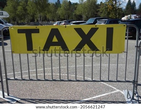 Taxi sign, mobility and passenger transport in an urban area