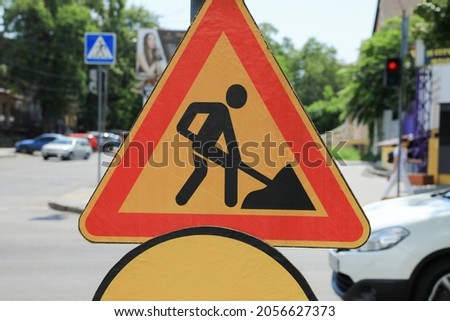Road construction sign on city street, closeup. Repair works