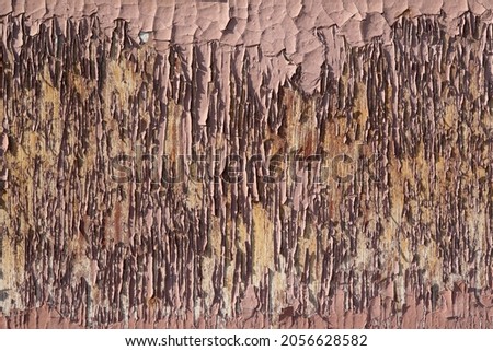 Peeling paint on a wooden surface. Background, pattern, abstract template.                                