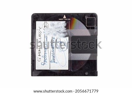 Small retro mini disc old audio data carrier top view, object isolated on white background, cut out, closeup, table top view, shot from above. Worn damaged text label, media storage, optical drive