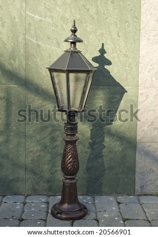 Old classical lantern standing on the ground