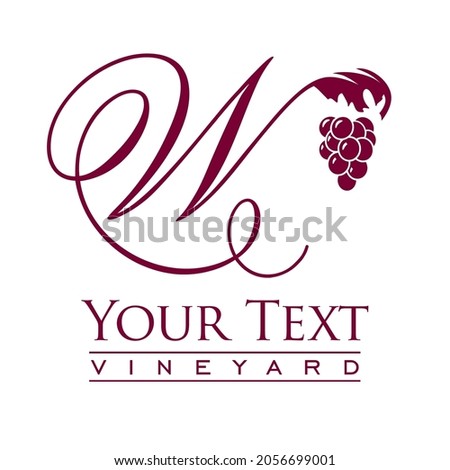 Script capital letter W decorated with grapes and vines 