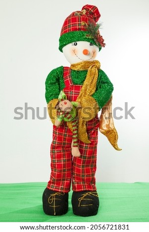Christmas Decoration - Snowman dressed in Christmas time clothes