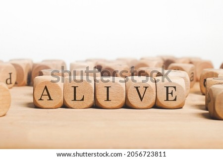 Alive Word Written In Wooden Cube