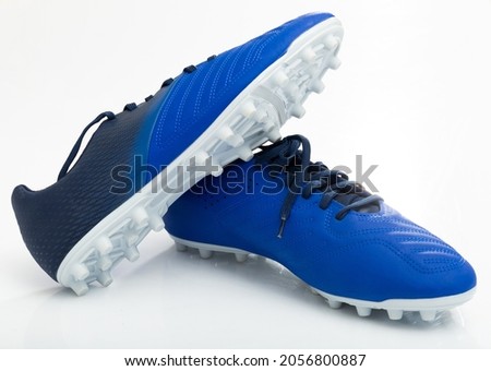 Traditional leather soccer boots isolated on white background. Concept of sports equipment and shoes for playing football Royalty-Free Stock Photo #2056800887
