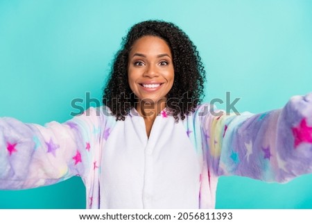 Photo of young black woman happy positive smile make selfie wear pajama bedtime isolated over teal color background