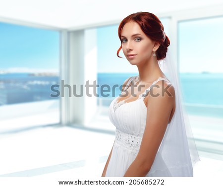 Portrait of Beautiful Young Fashion Bride in interior.