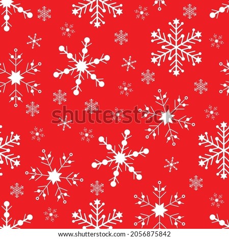 New Year and Christmas seamless pattern. White snowflakes on a red background.
