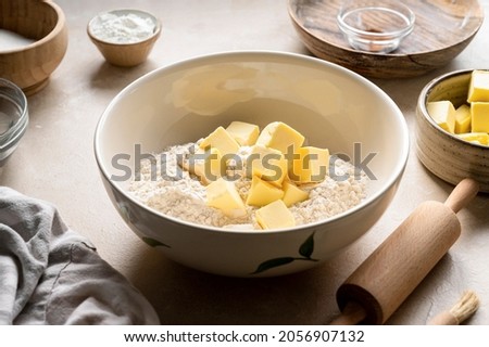 Baking pastry concept - mixing dough from butter and flour. Cooking a desset, pie, cookies, Step by step recipe. Royalty-Free Stock Photo #2056907132