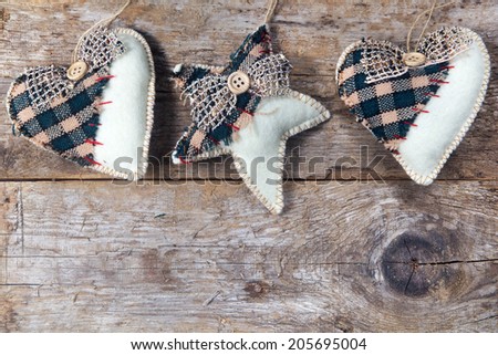 fabric country hearts and star hanging on wooden