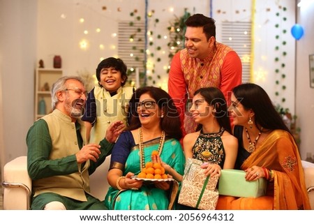 Joint family celebrating diwali at home with full of happiness Royalty-Free Stock Photo #2056964312