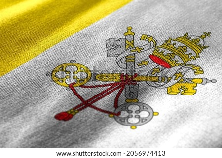 Close up waving flag of Vatican City. Concept of Vatican.