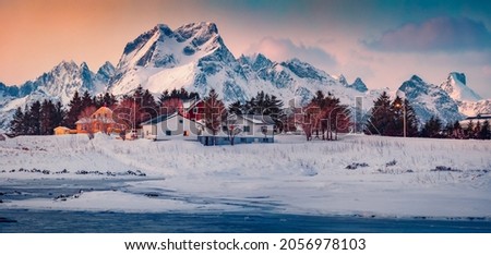 Frozen Torsfjorden fjord. Panoramic winter view of Fredvang village, Lofoten Islands, Norway, Europe. Stunning sunset on Norwegian sea. Traveling concept background. Beautiful winter scenery.
 Royalty-Free Stock Photo #2056978103