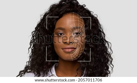 Cheerful cute black lady make identity authentication for personal data protection, double exposure and digital hologram. Facial scanning and recognition, innovations of future and biometric, collage Royalty-Free Stock Photo #2057011706