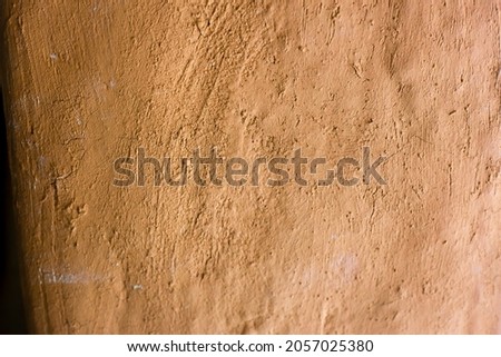 Mud background, building of wall clay house structure. Selective focus. Soft picture