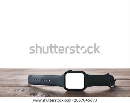 Black smart watch on table with isolated background
