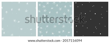 Winter snow vector seamless pattern set. Minimalist scandinavian repeat background with abstract snowflakes in black, white and soft blue colours. Royalty-Free Stock Photo #2057116094