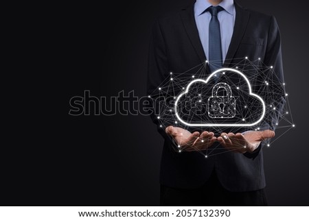 Business man hold,holding cloud computing data and security on global networking,Padlock and cloud icon. Technology of business.Cybersecurity and information or network protection.internet project.