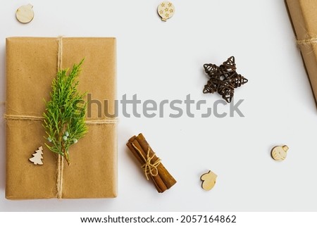 Christmas composition of cones, cinnamon and stars on a craft background. Minimalism style. View from above.