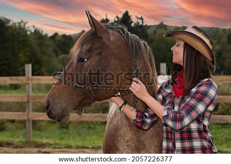 A beautiful cowgirl with a horse