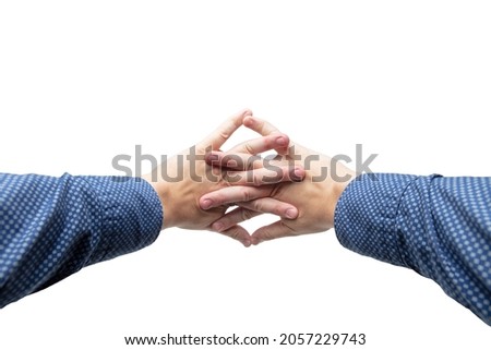 Two stiffened hands crossed fingers and stretches forward, isolated on white