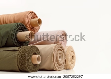 Rolls of pastel color fabric isolated on white Royalty-Free Stock Photo #2057252297