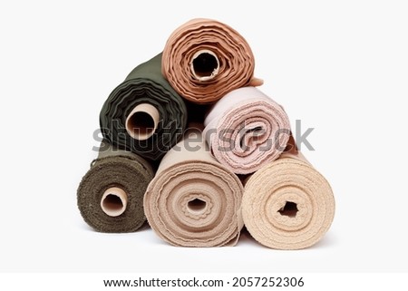 Stack of pastel color fabric rolls isolated on white, Synthetic and natural fabrics with copyspace Royalty-Free Stock Photo #2057252306